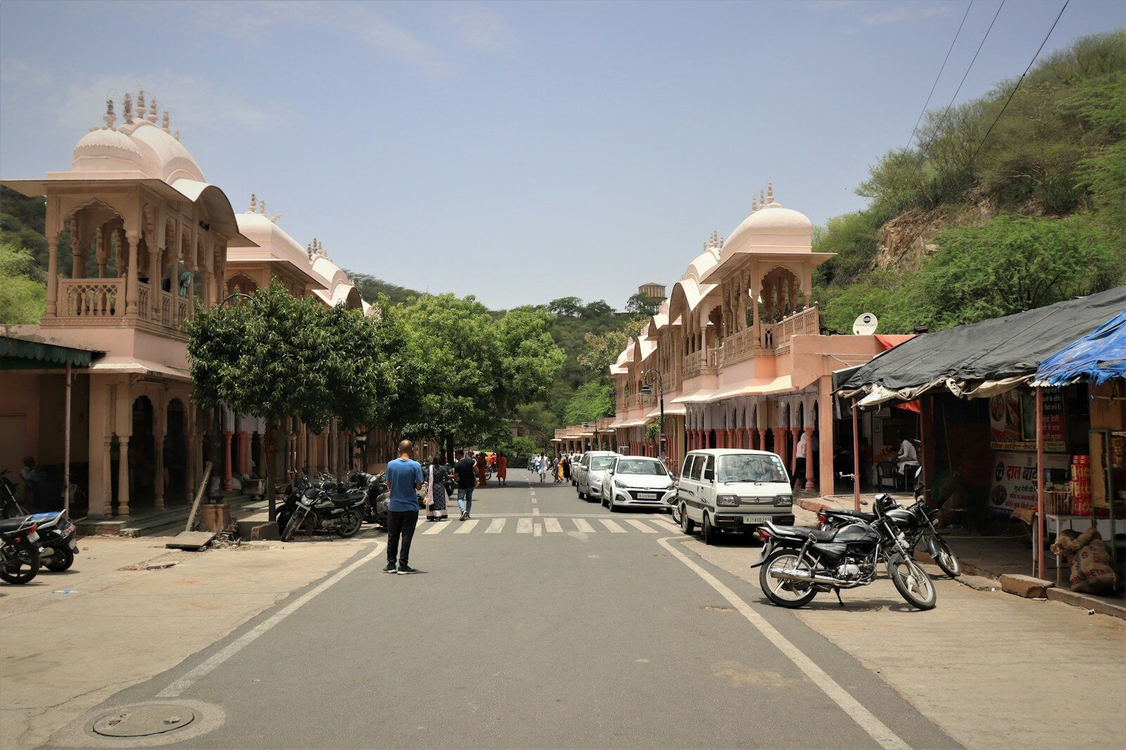 a man standing in the middle of a street
